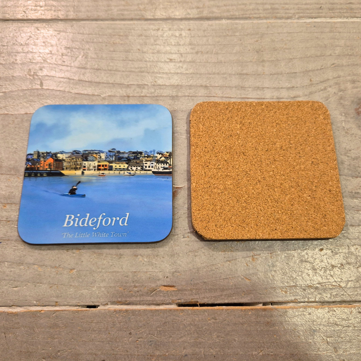 Bideford Town cork back coaster with blue sky, blue water and kayaker by Jagos Art