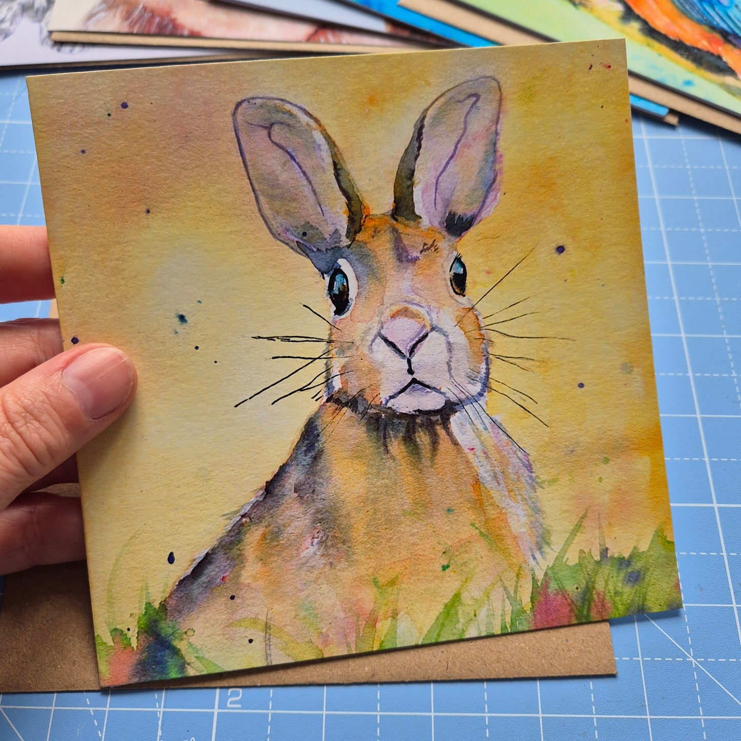 Hare greeting card with whimsical artwork by Jagos Art with vibrant yellow background