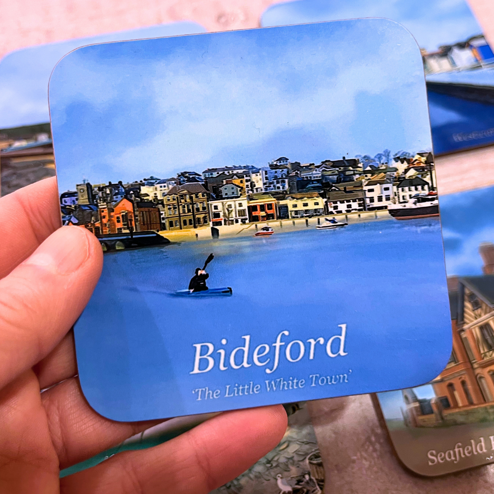 Bideford Town North Devon coaster with blue sky, blue water and kayaker by Jagos Art