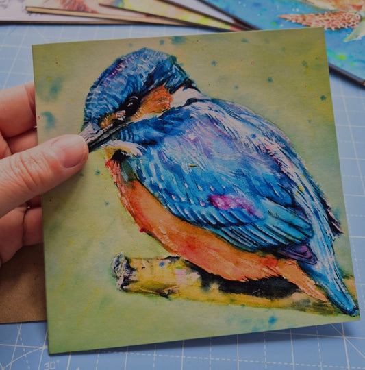 Kingfisher greeting card by Jagos Art held in hand