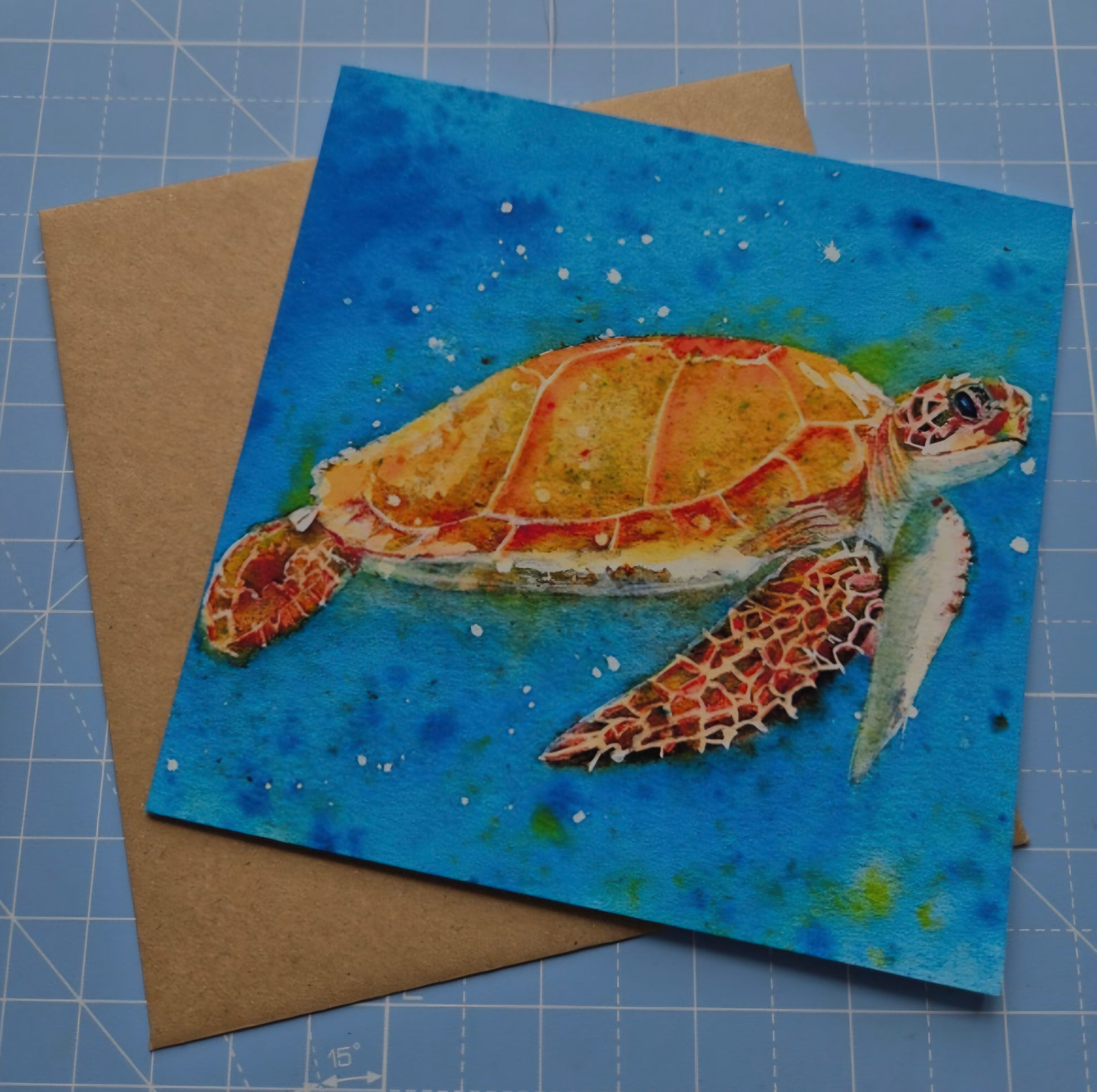 Sea Turtle square greeting card with vibrant blue background and kraft eco friendly envelope
