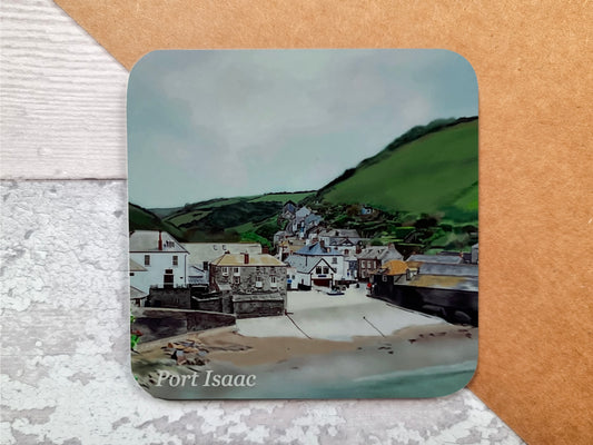 A table coaster featuring a print of Port Isaac showing the beach, the village and the fields in the background