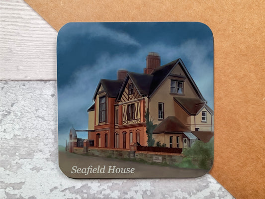 A table coaster featuring a print of Seafield House, the house on the cliffs, in Westward Ho 