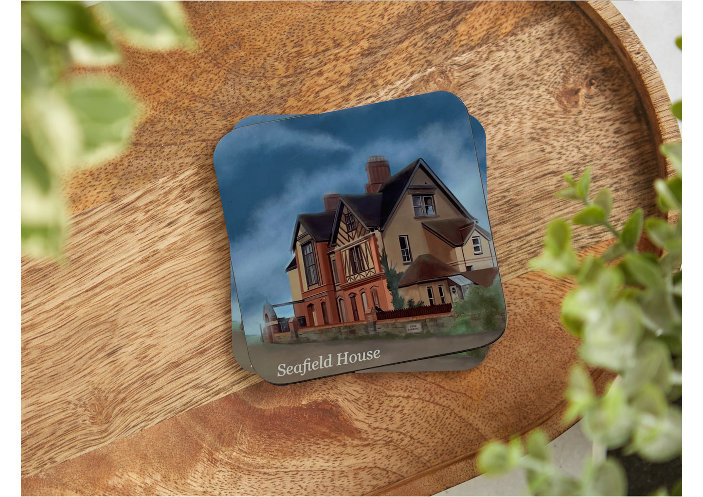 A table coaster featuring a print of Seafield House, the Haunted House, in Westward Ho