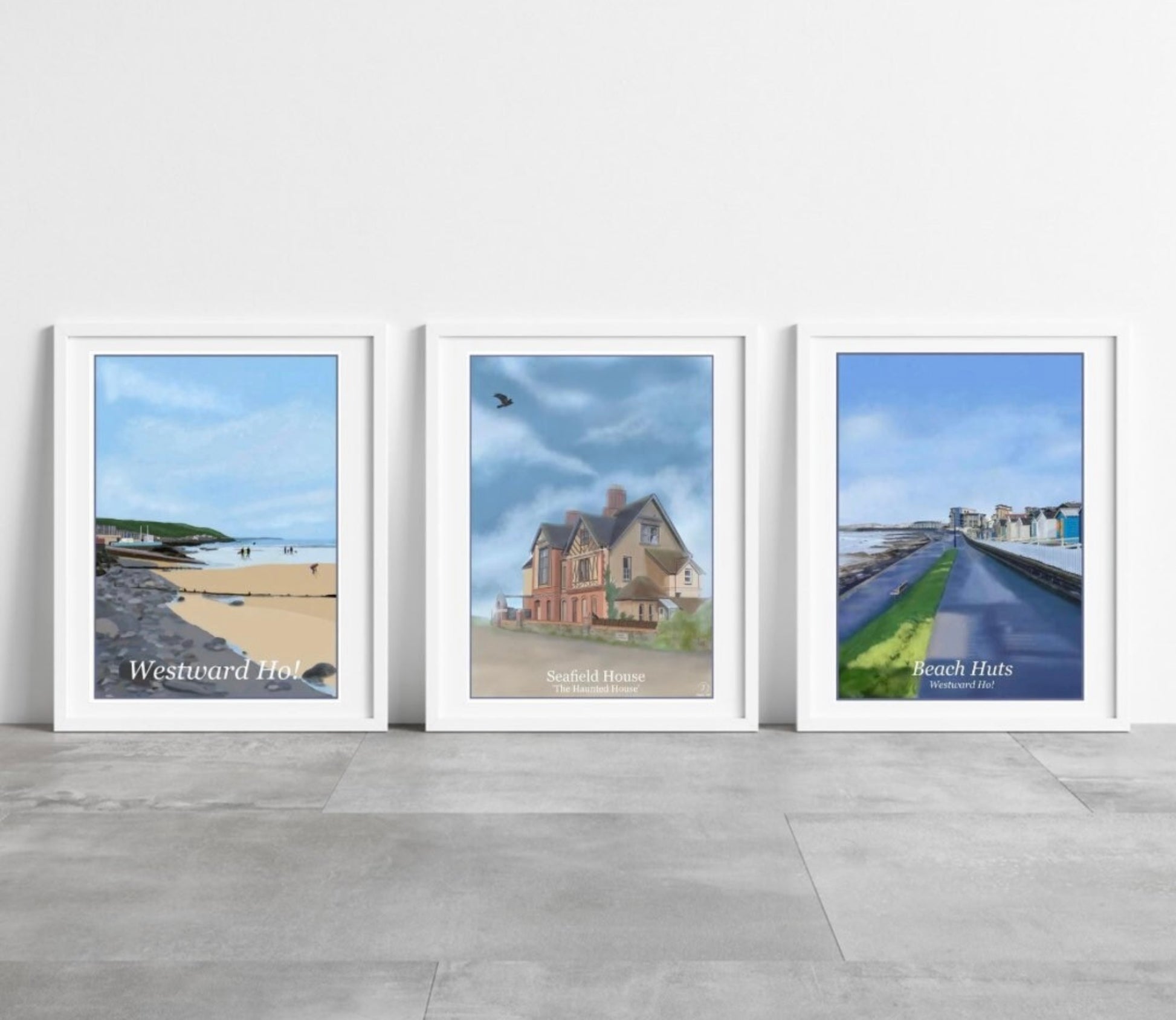 a photo showing three art prints by Jagos Art of locations in Westward Ho, The Seafront, Seafield House and also the beach huts 