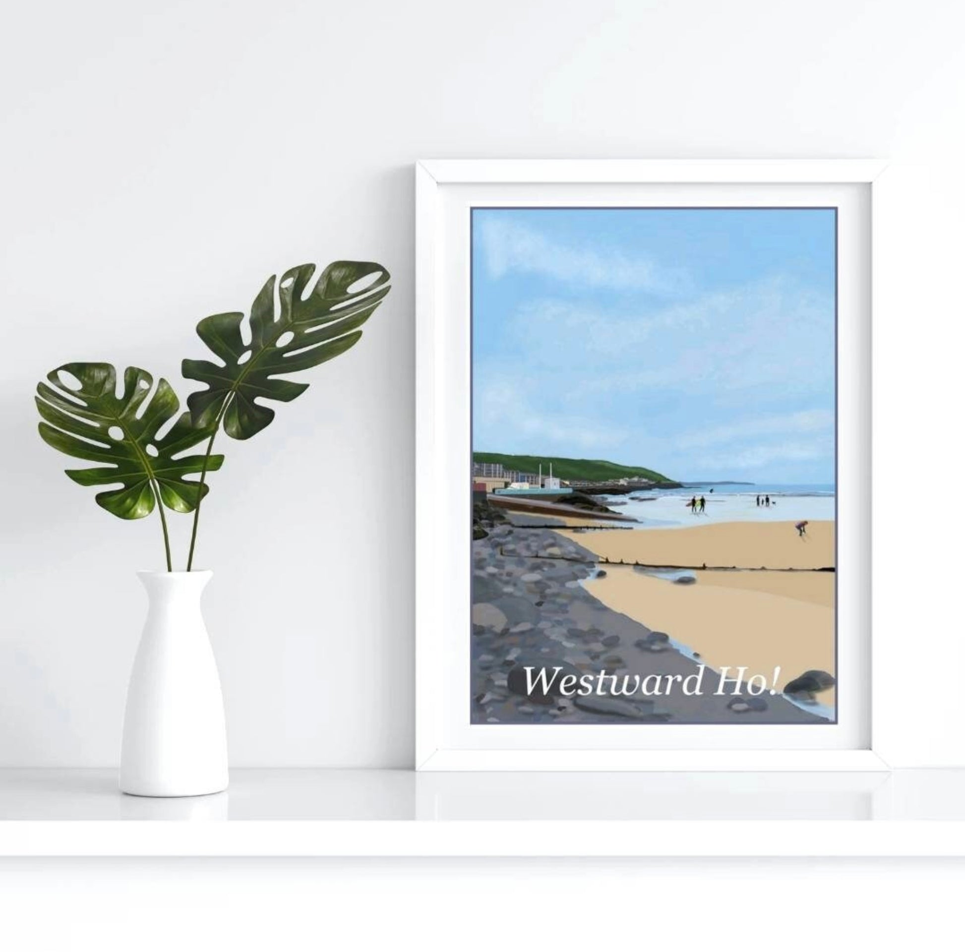 an art print of Westward Ho in North Devon featuring the sea front, the cliffs in the distance and some surfers walking across the sand towards the sea