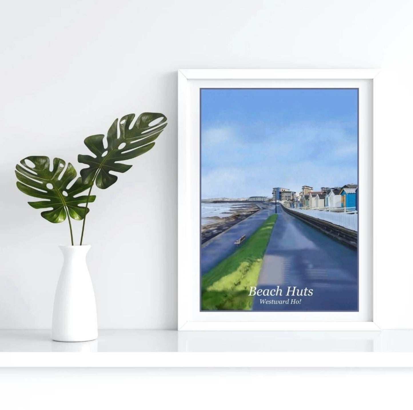 an art print by Jagos Art of Westward Ho in North Devon showing the promenade along the sea front which runs parallel to the the rock pool and the beach huts