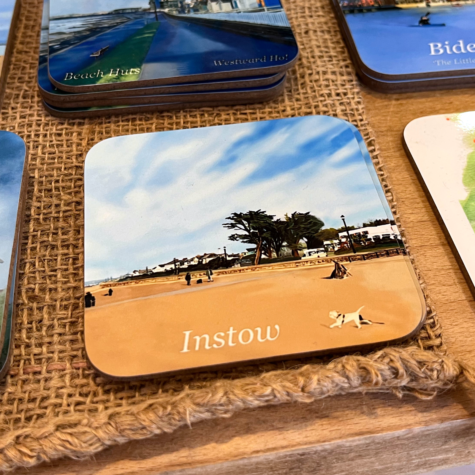 Instow Beach coaster by Jagos Art with golden sand, blue sky and Instow promenade
