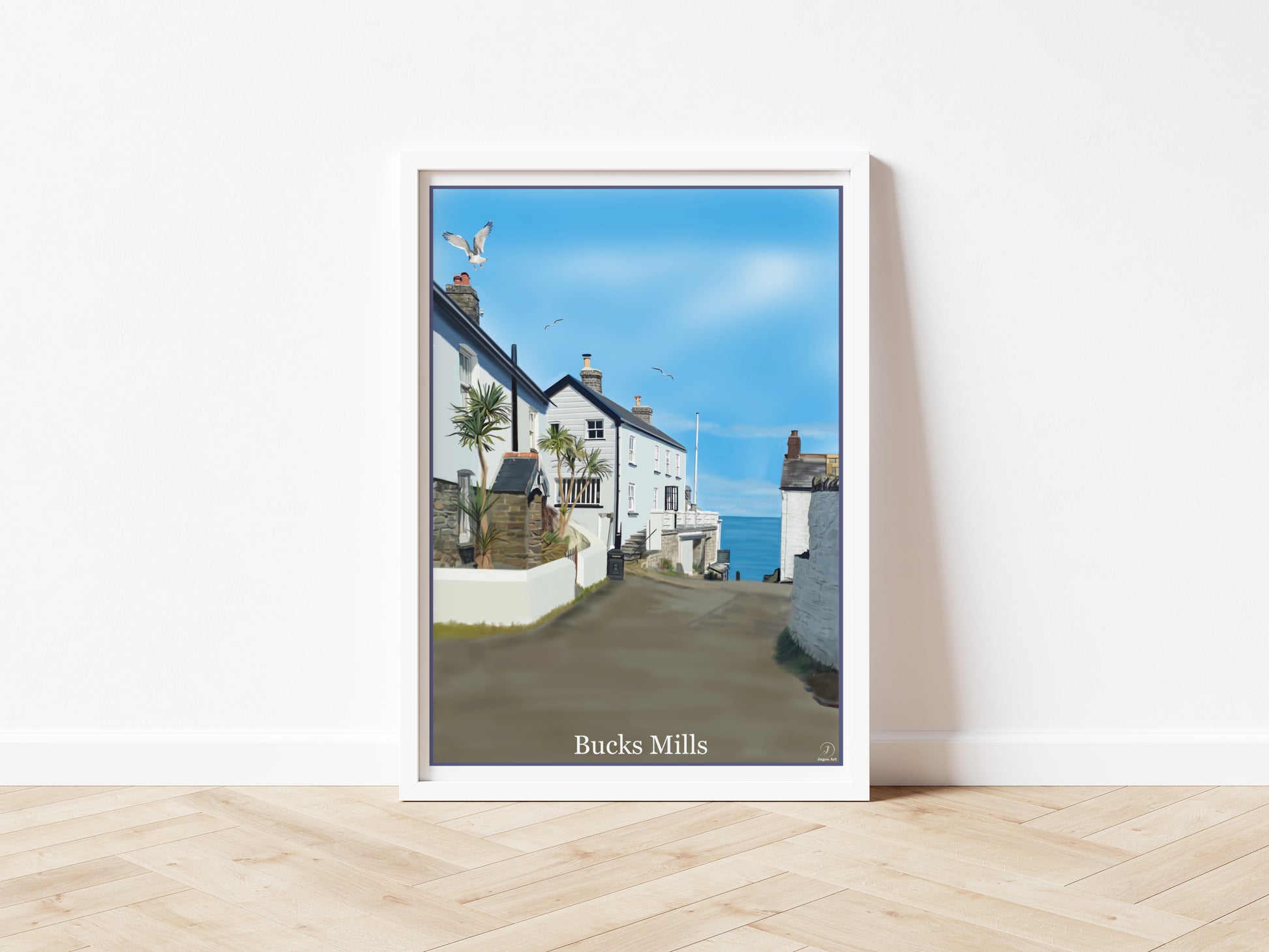 An art print by Jagos Art featuring the gorgeous hidden away village of Bucks Mills in North Devon England showing some of the houses, the sea and seagulls flying overhead drawn in the style of the old vintage railway posters