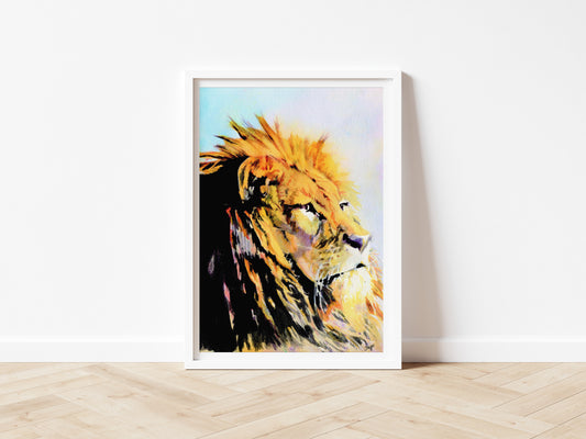 An art print of an original watercolour painting of a stunning Lion with a majestic look on his face and a golden mane primary colours being tones of yellow and orange