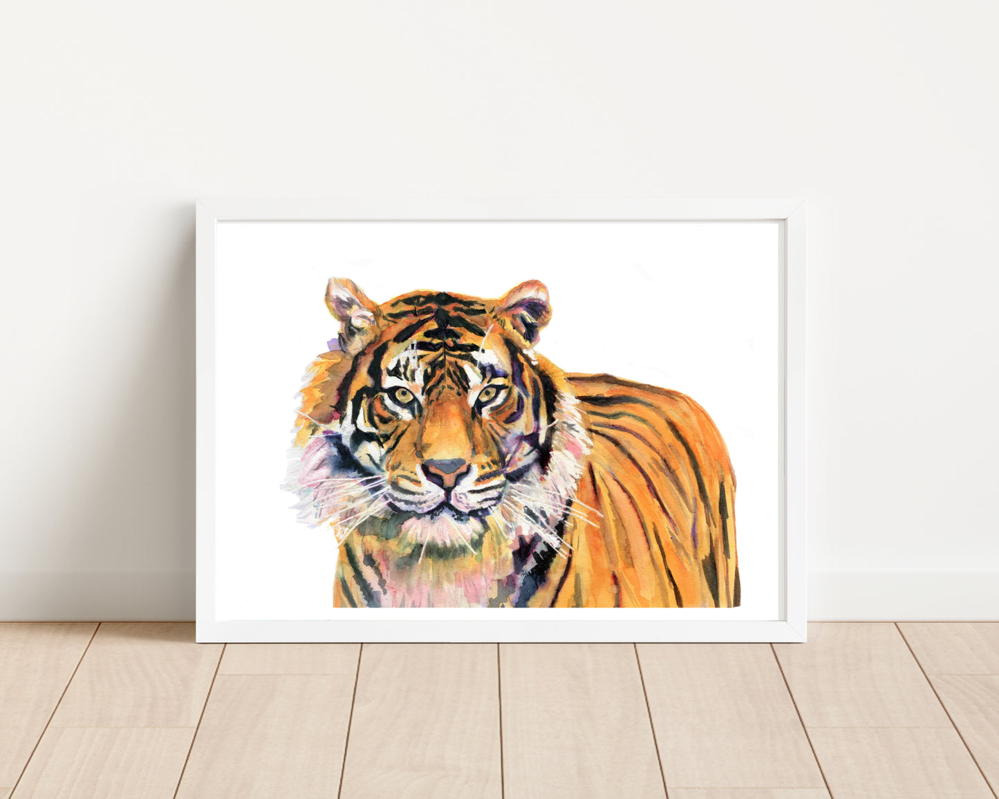 An art print of an original watercolour painting of a stunning Tiger looking right at the viewer with the primary colours being orange with purple tones